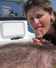 5 pictures of Skinny blonde mature is sucking small dick on a yacht until man cum